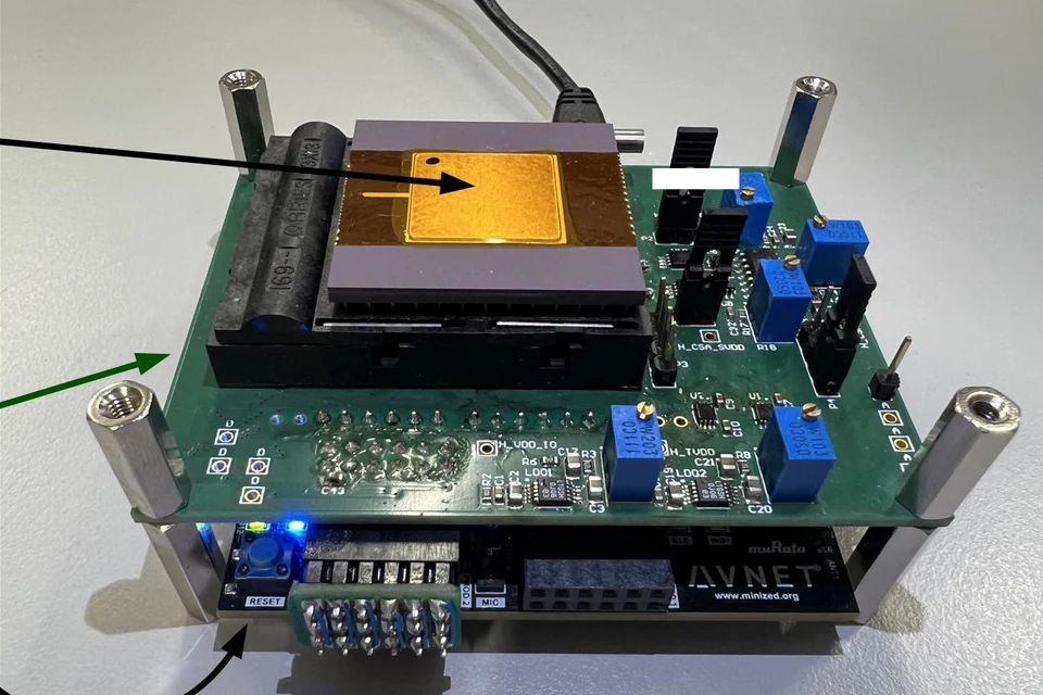 DeltaKWS keyword-spotting chip on its measurement board and MiniZed FPGA host.